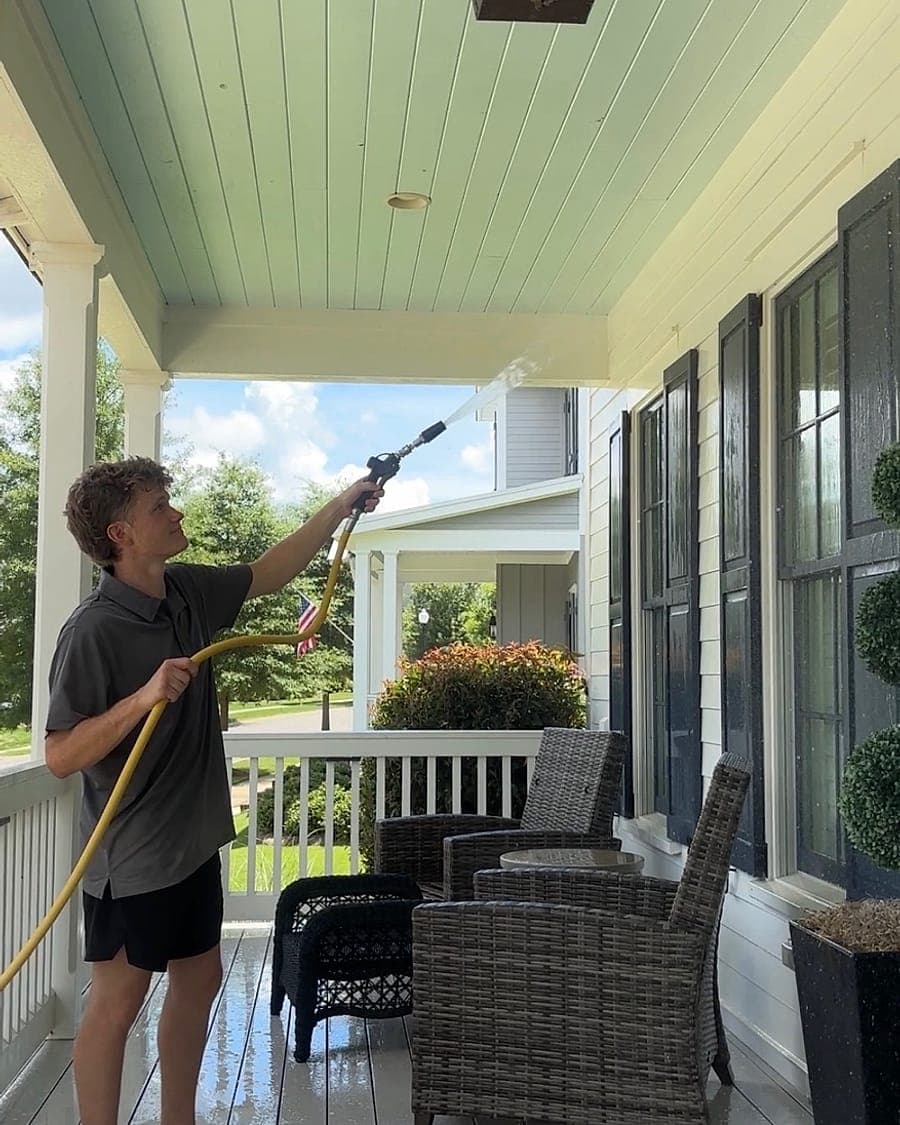 Bluestone Pro Wash crew soft washing a covered porch