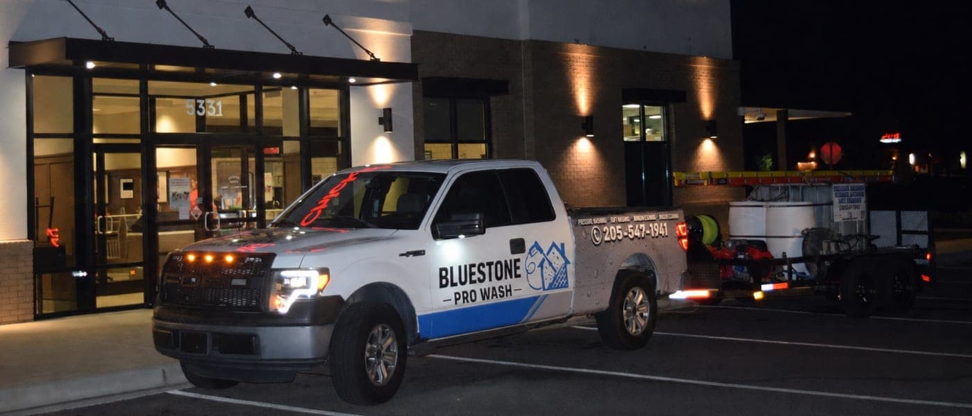 The Bluestone Pro Wash truck and equipment trailer parked for an after-hours commercial wash in Birmingham